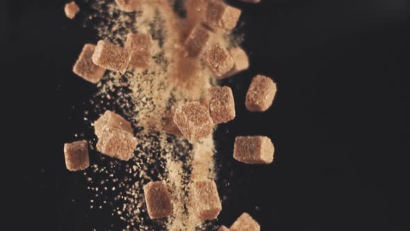 Super Slow Motion Drop Pieces of Cane Sugar