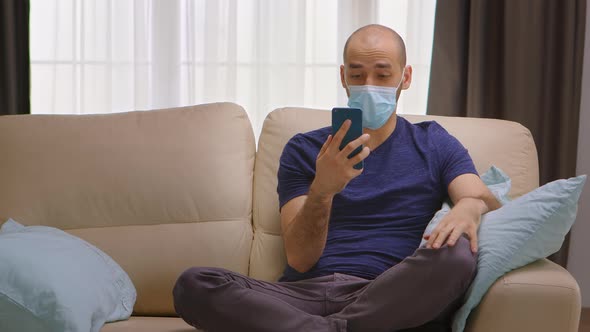 Man with Protection Mask on a Video Call