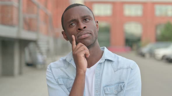 Outdoor Portrait of Pensive African Man Thinking