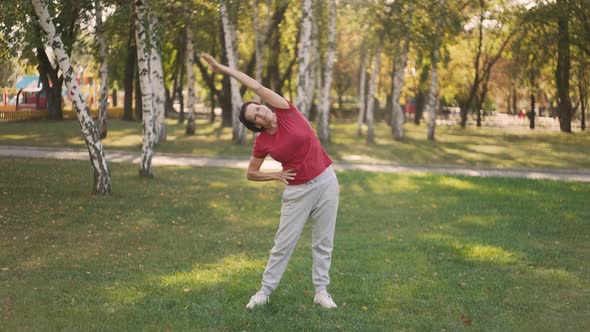 Elderly Woman Stretching at the Park