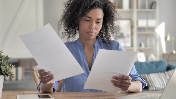 African Woman Reading Contract