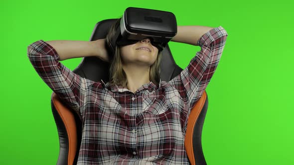 Young Woman Using VR Headset Helmet To Play Game. Watching Virtual Reality 3d 360 Video. Chroma Key