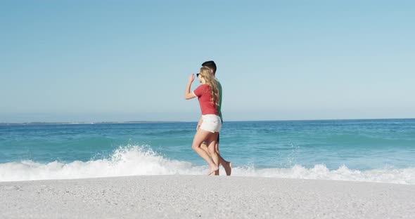 Couple in love enjoying free time on the beach together