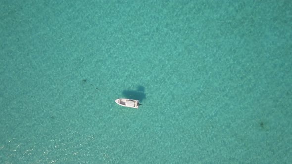 Aerial drone view of a fishing motor boat in the Bahamas, Caribbean. 