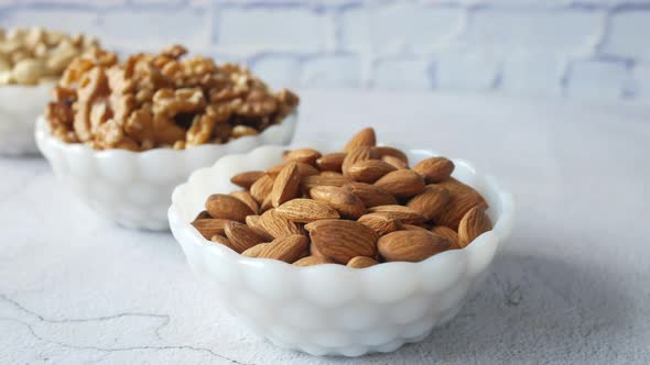 Walnut  Cashew Nut and Almond in a Container on Table