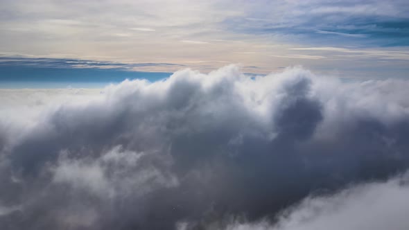 Reveal Footage of Aerial View From Above at High Altitude of Dense Puffy Cumulus Clouds Forming