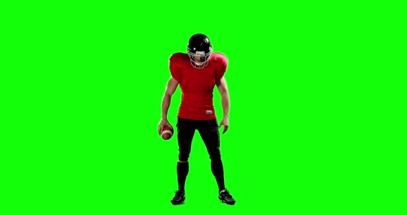 American football player holding ball