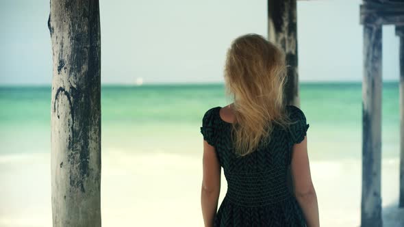 Woman Relaxing On Bahamas Flowing Dress Blowing In Wind. Girl Walking Tropical Hawaii Beach.