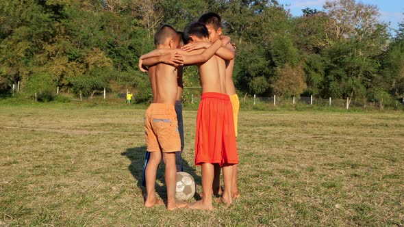 Countryside Kids Soccer Team In Huddle