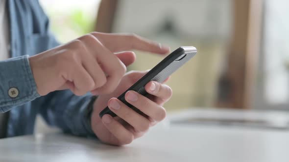 Close Up of Hand Typing on Smartphone