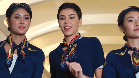 Cabin Crew Dancing with Joy in Airplane