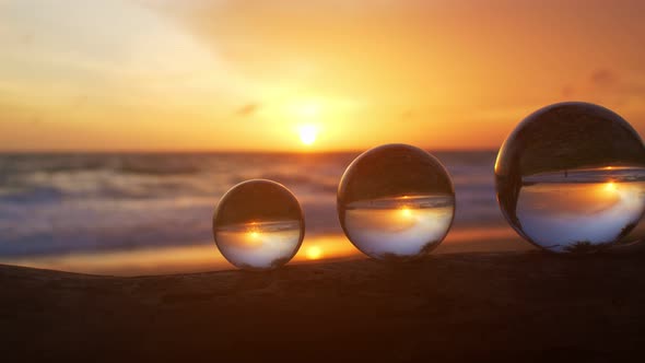 Three Crystal Balls In Beautiful Sunset On The Beach