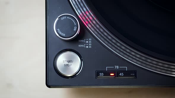 Black Modern Turntable with Rotating LP Record