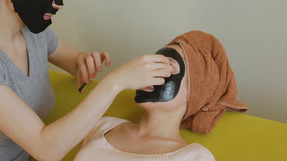 Woman Applies Slices of Cucumber on Her Friends' Eyes