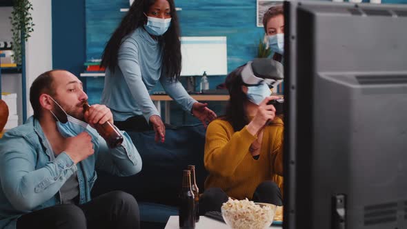 Friends Experiencing Virtual Reality Playing Video Game Wearing Vr