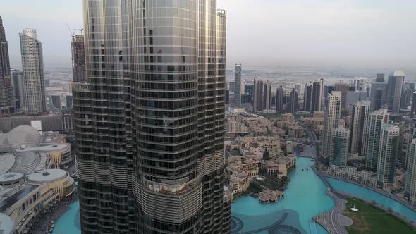 Aerial view of Burj Khalifa skyscrapers and turquoise pool, Business Bay, Dubai.