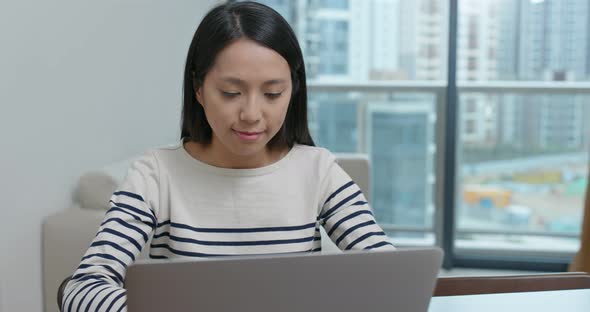 Woman work on computer at home