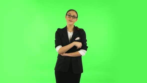 Woman Coquettishly Smiling While Looking at Camera. Green Screen