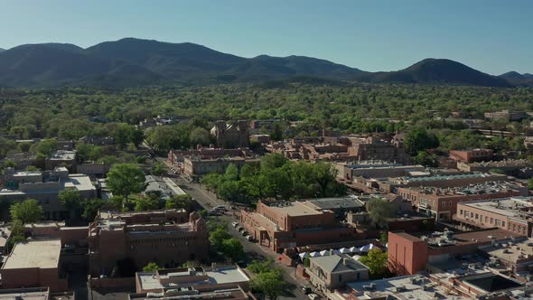 Aerial moving away from downtown Santa Fe New Mexico skyline