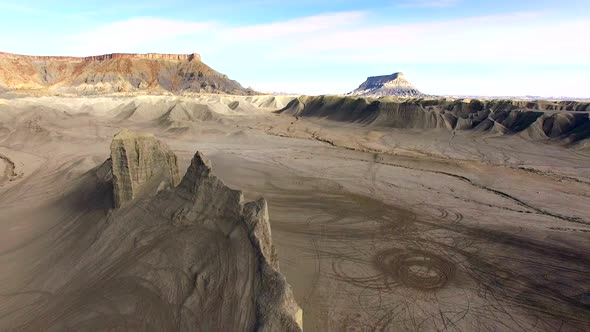 Flying backwards over desert badlands in Utah