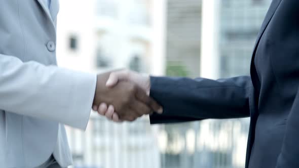 Slow Motion Shot of People Shaking Hands Outdoor