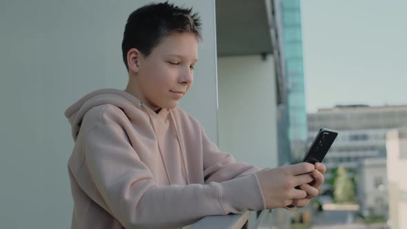 Teenager on the Balcony Chatting