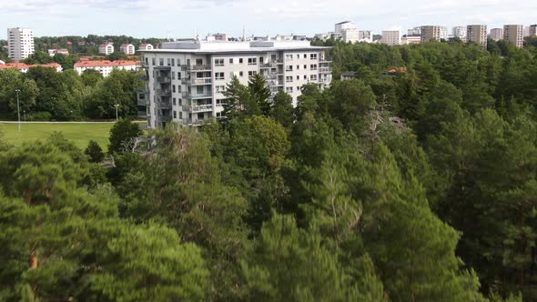 Popular suburban neighborhood of Vallingby in Stockholm, Sweden. Aerial forward rising reveal