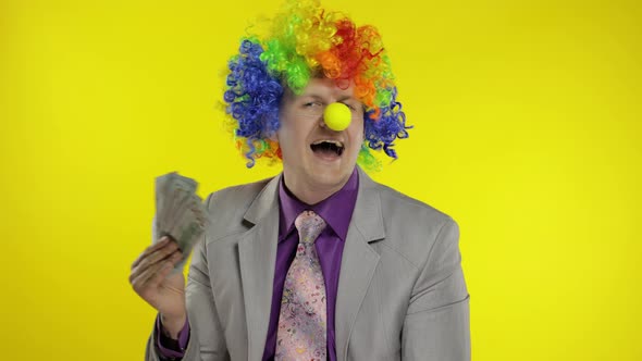 Clown Businessman Entrepreneur Boss in Wig with Money Banknotes at Work