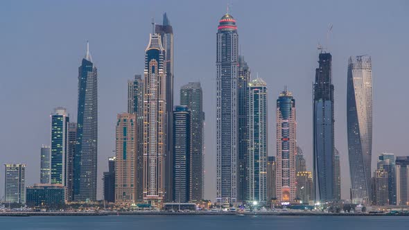 Dubai Marina Skyline Day to Night Timelapse As Seen From Palm Jumeirah in Dubai UAE