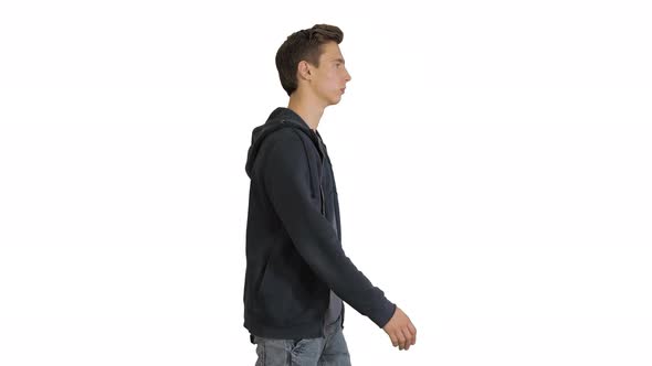 Attractive Casual Young Man Walking on White Background