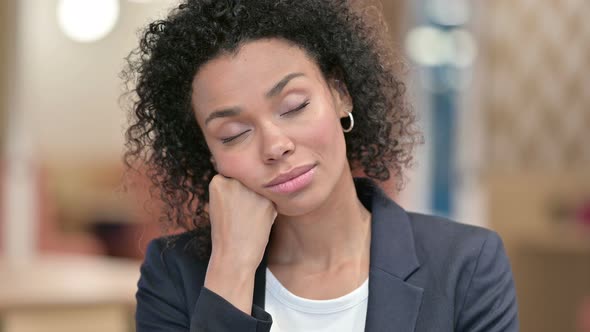 Portrait of Sleeping African Businesswoman in Office