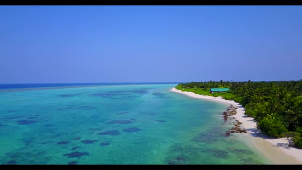 Aerial abstract of idyllic seashore beach journey by blue green sea with white sandy background of a