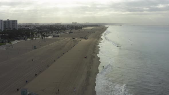 AERIAL: Flight Over Venice Beach with Waves in the Morning, Los Angeles, California 