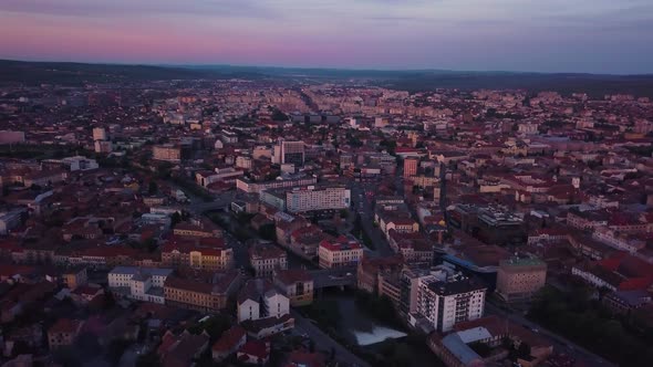 Sunset Red Skyline at Cluj, Romania, Transylvania. Aerial drone over European valley town city with