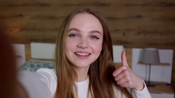 POV Shot of Young Woman Blogger Influencer Holding Mobile Phone Wave Hand Hello Make Video Call