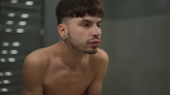 Reflection of Confident Handsome Young Man Washing Beard with Water in Slow Motion in Bathroom