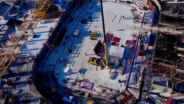 Central Part of Future Sports Arena with Crane and Builders