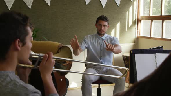 Teenage musicians rehearsing