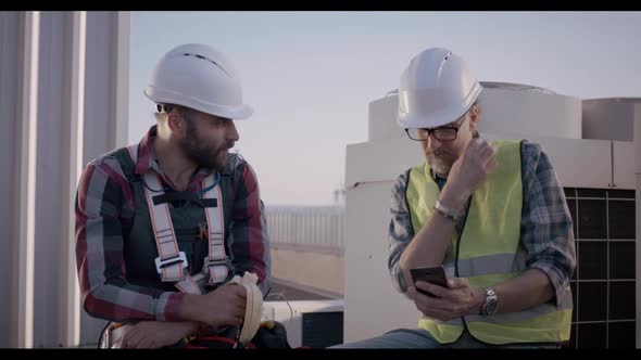 Engineers Having a Break on a Cell Tower