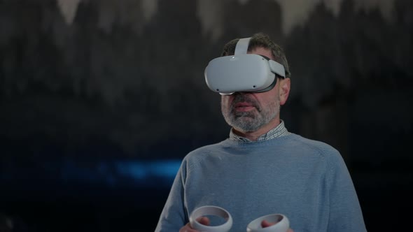 Man in VR Headset Standing in Ice Cave on the Right