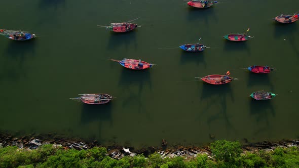 Many fishing boats on the coast beside the mountains, beautiful sea area in Thailand.