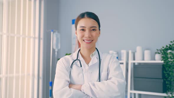 Portrait of beautiful physician doctor standing in office hospital.