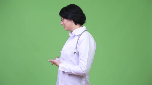 Beautiful Woman Doctor with Short Hair Presenting Something