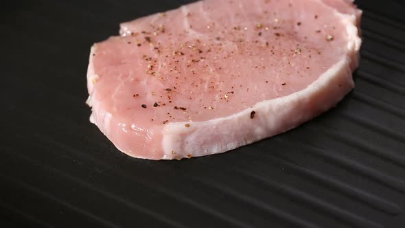 Grilling pork chop slices