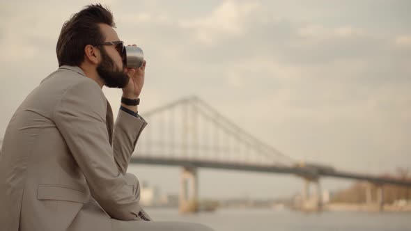 Man Enjoying Holiday And Drinking Coffee. Businessman Drinking Tea On Vacation.