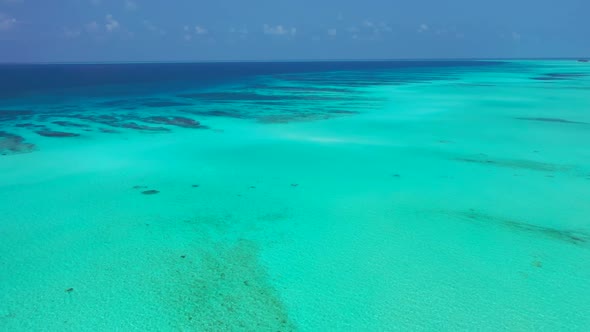 Aerial top down scenery of paradise shore beach lifestyle by blue ocean and white sand background of