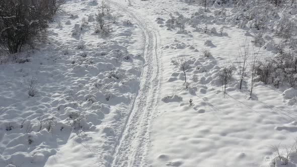 Morning after snowing with foot path 4K drone footage