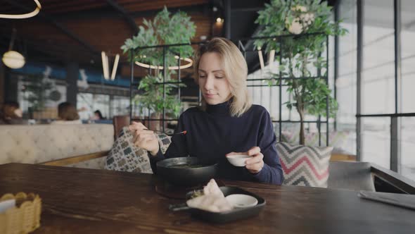 Attractive Blonde in a Restaurant