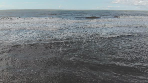 Drone flying over of big waves in Shekvetili sand beach