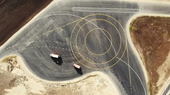 Aerial View of Trucks That Stand on the New Roadbed